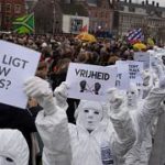 Амстердам: многотысячные протесты вопреки запрету и забастовка полицейских